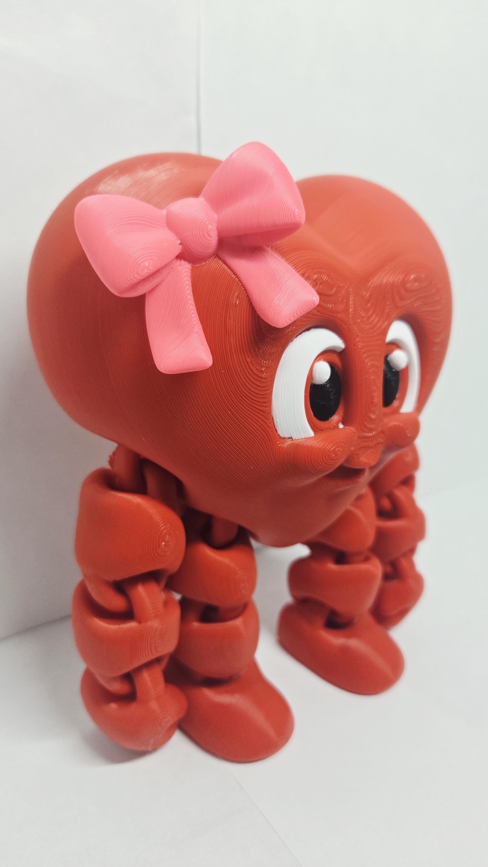 A three-quarters angle view of the standing Valentine heart decoration showcasing its smooth, rounded curves and polished edges