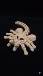 Detailed close-up of the 3D printed Facehugger figure in a menacing, ready-to-strike pose