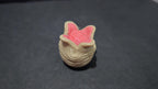 Close-up of the 3D printed hatching Ovomorph egg with vibrant pink interior detailing