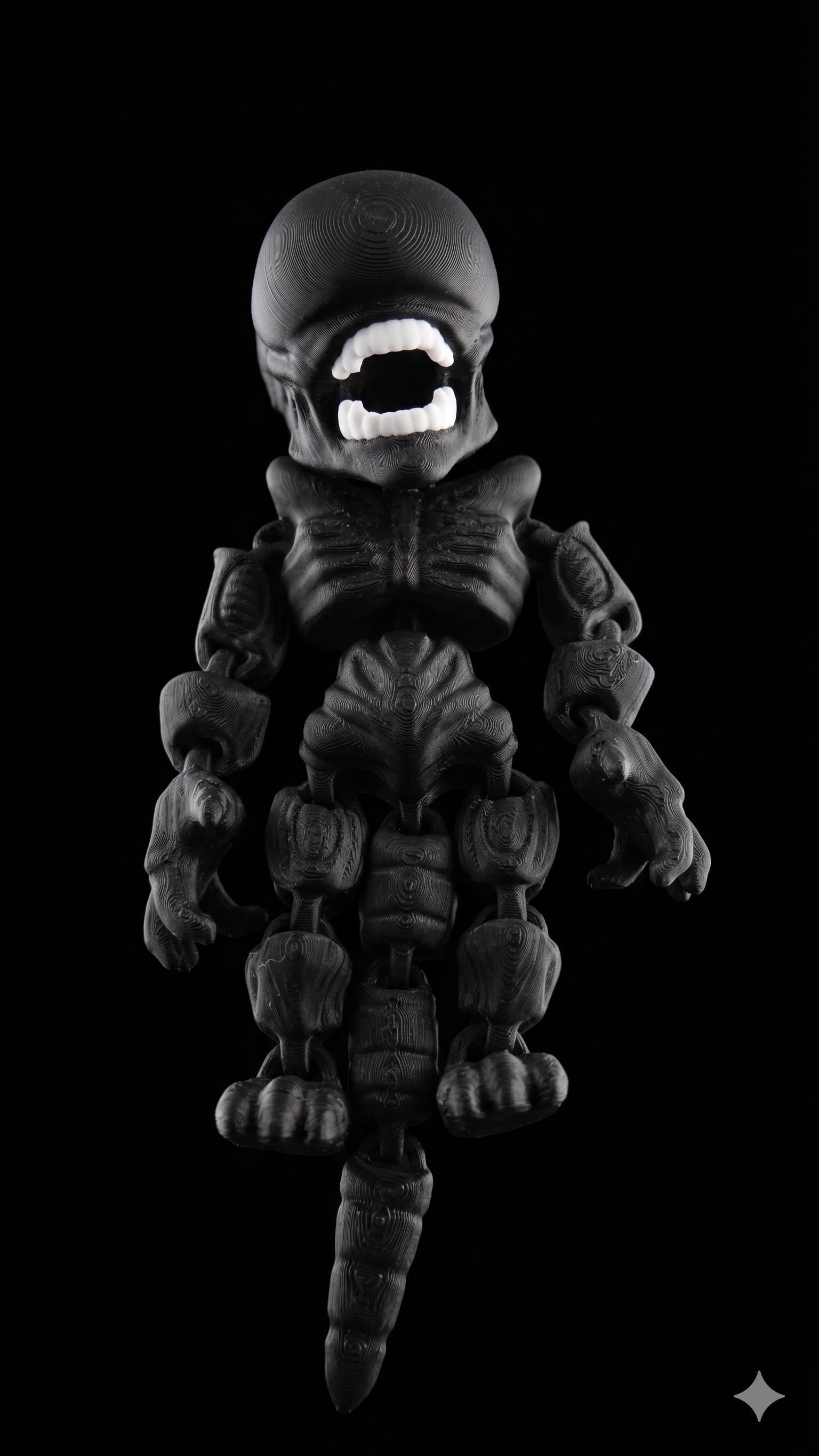 Full 3D printed Xenomorph flexi figure with white inner jaw detail standing upright on a black background as the main product view