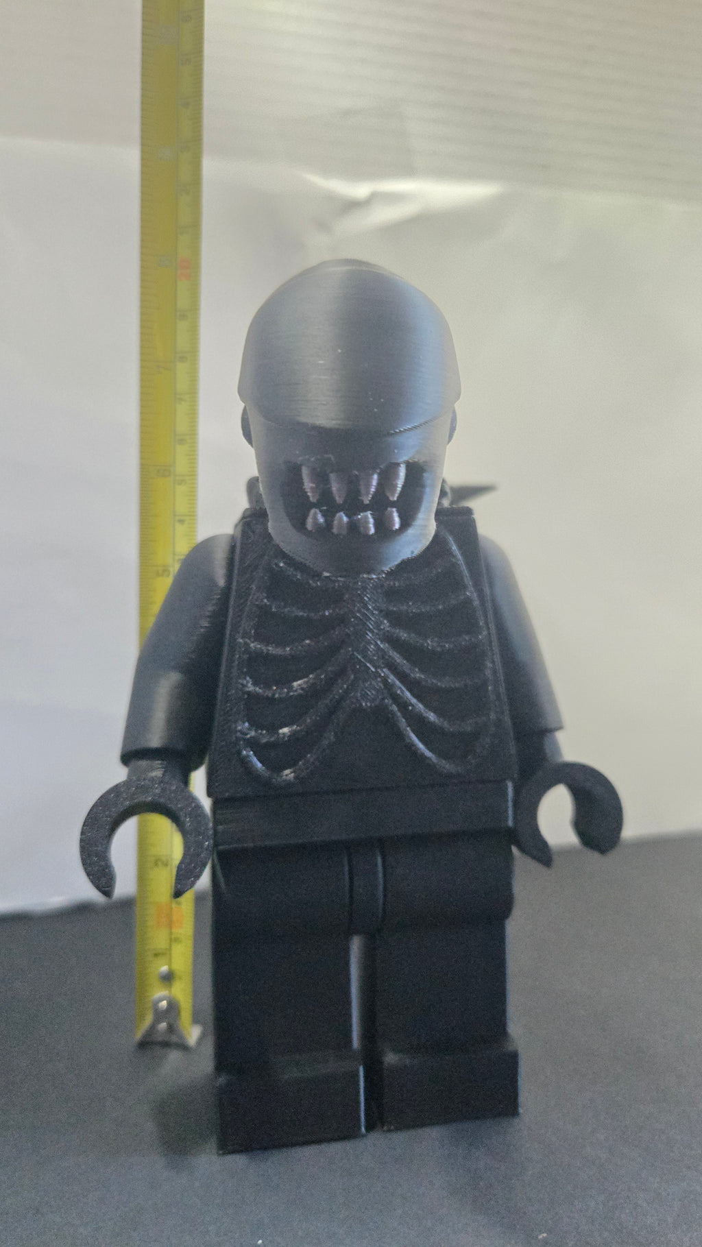 Measuring tape showing the towering height of the scaled oversized Alien Xenomorph megafig
