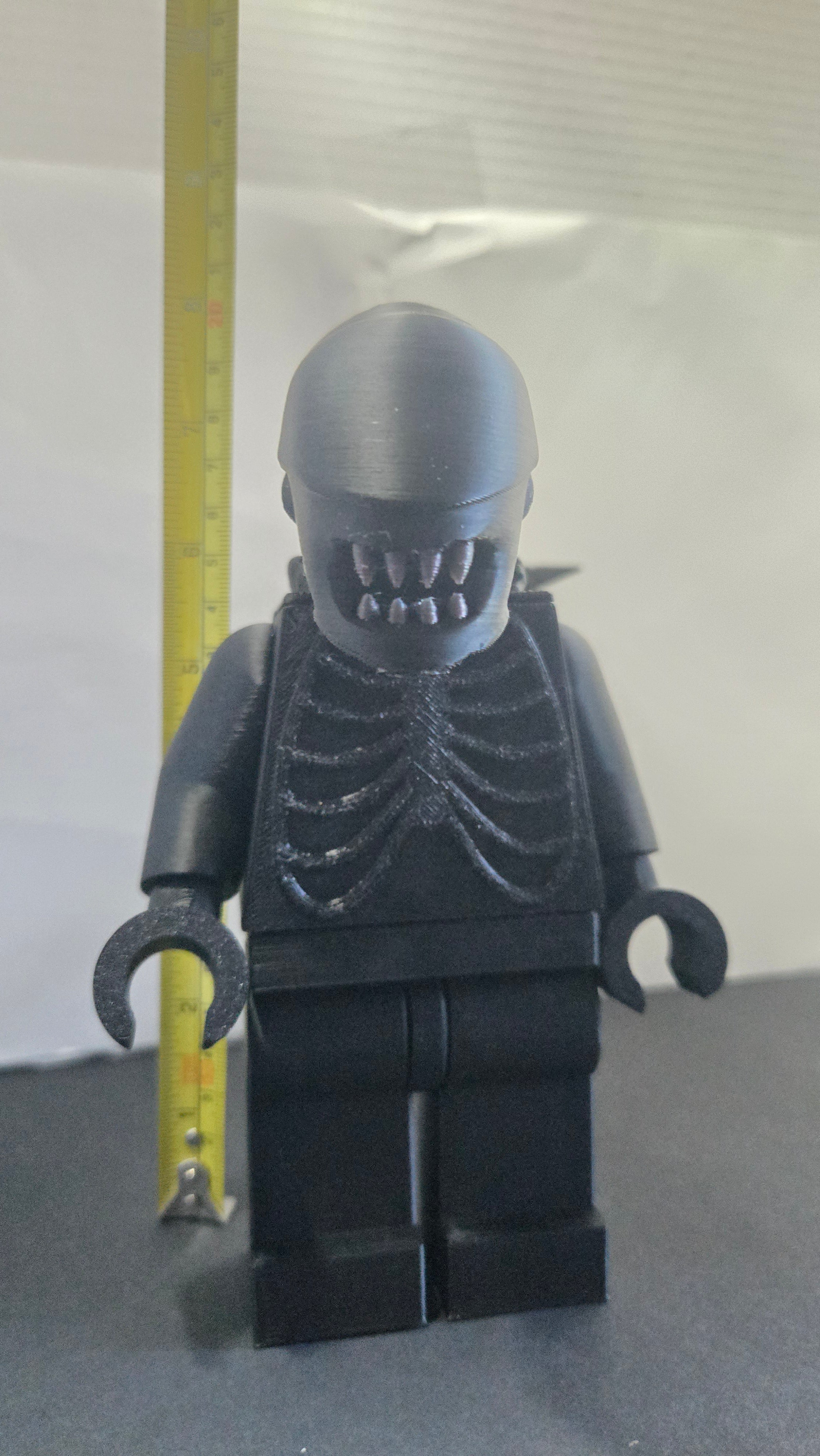 Measuring tape showing the towering height of the scaled oversized Alien Xenomorph megafig
