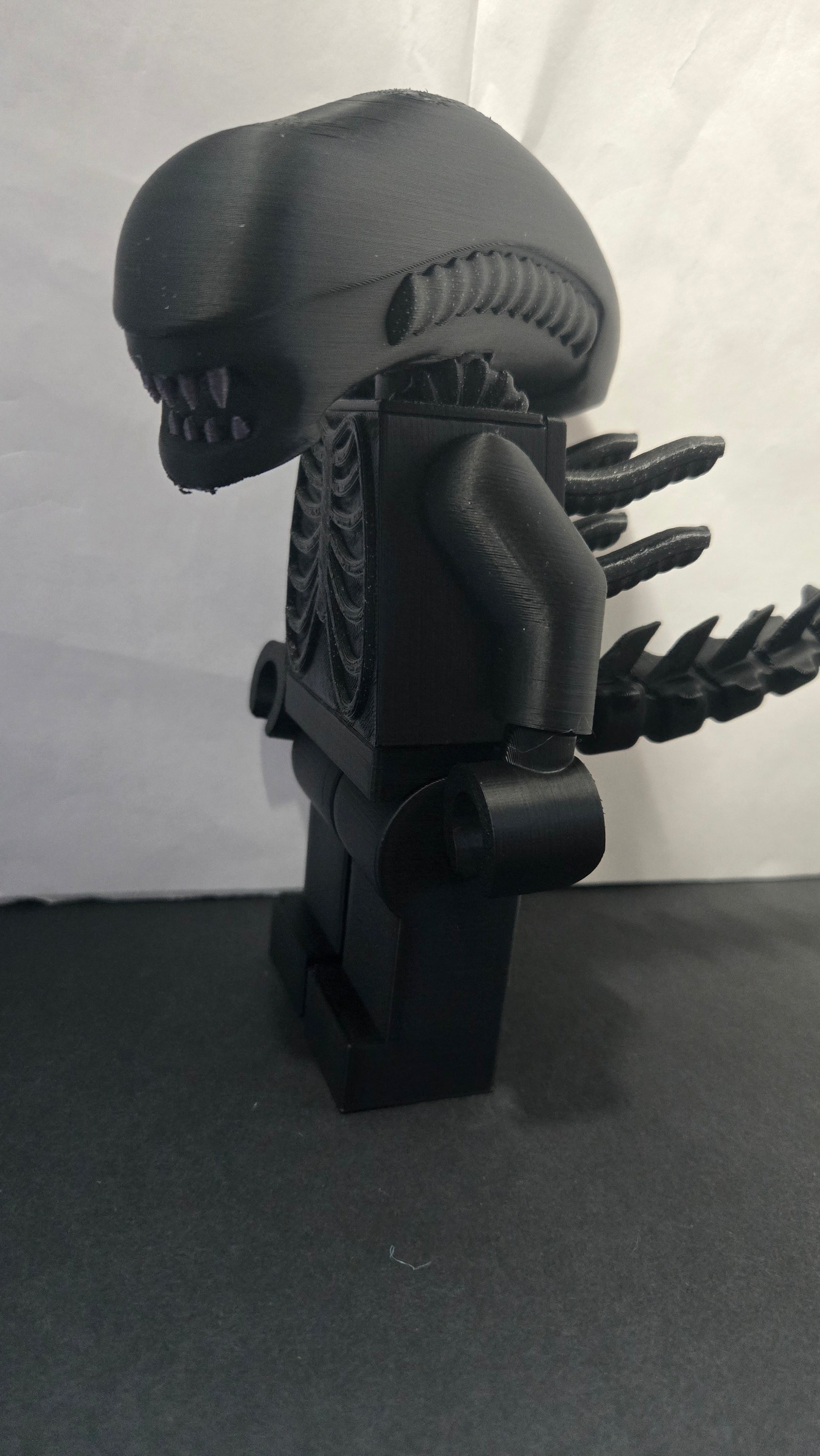 Left side profile view of the oversized Alien Xenomorph brick collectible