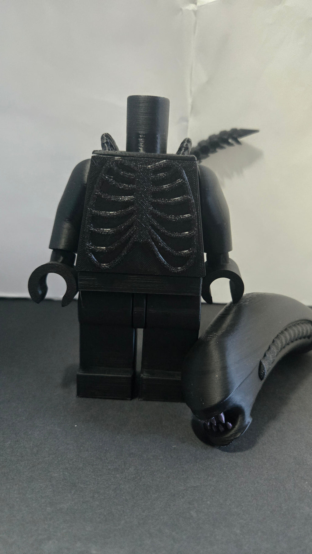 Oversized Alien Xenomorph megafig shown with the head detached to highlight the modular build style