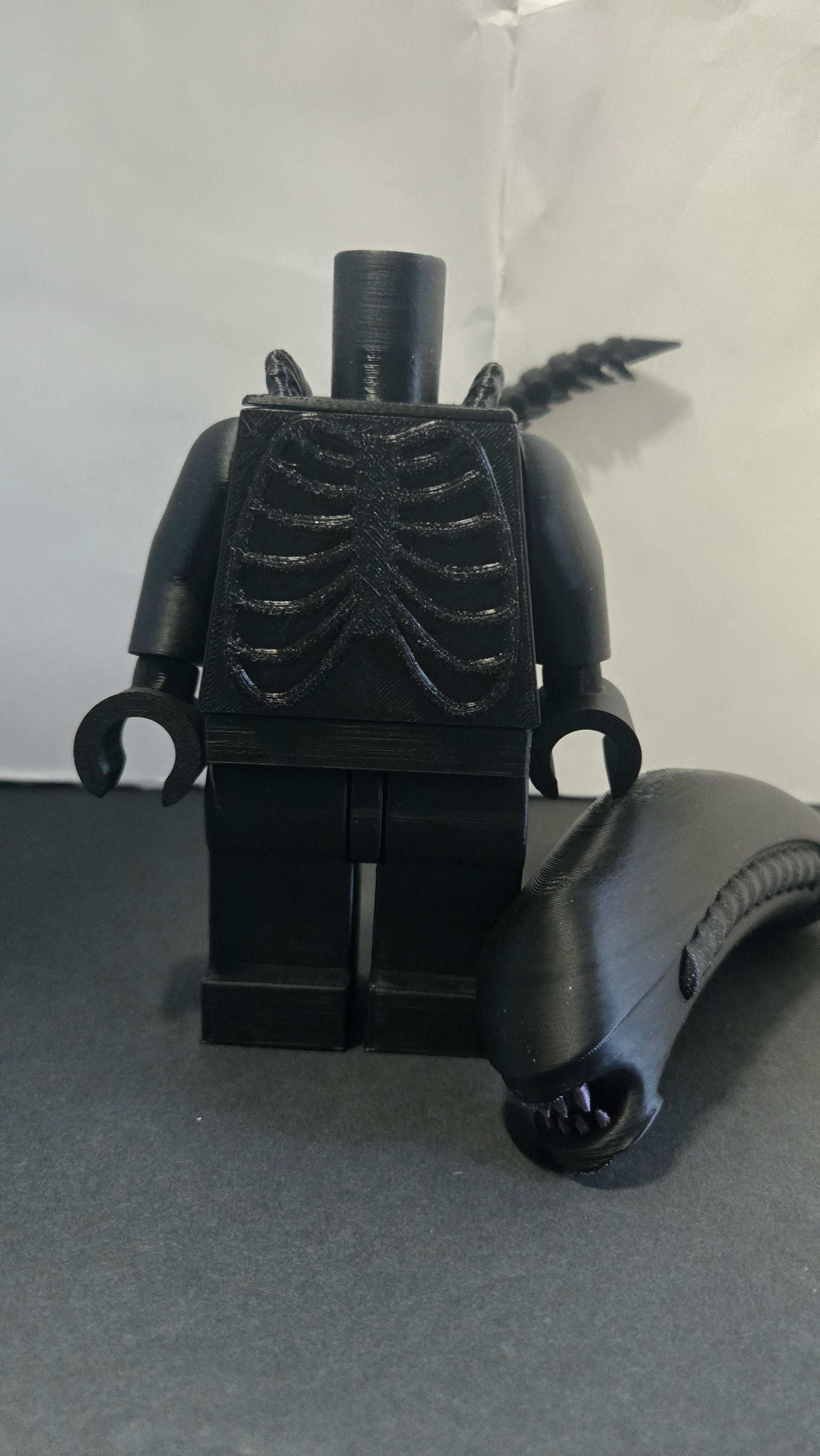 Oversized Alien Xenomorph megafig shown with the head detached to highlight the modular build style