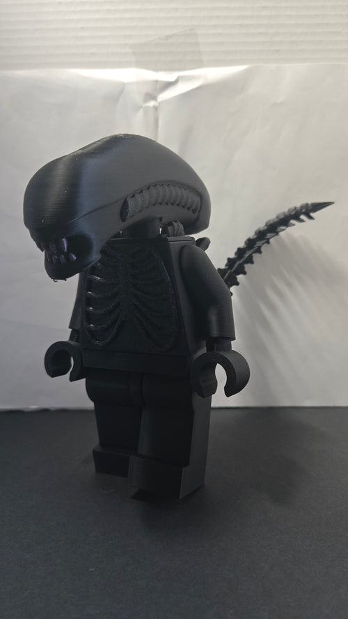 Three-quarter view of the oversized Alien Xenomorph brick megafig showing its head shape and tail