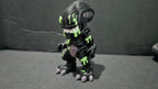 Full-grown 3D printed Xenomorph warrior with acid-green highlights standing in a classic hunting pose