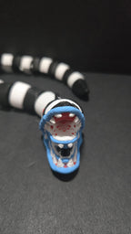 Front view of the Beetlejuice sandworm flexi figure showcasing its wide open jaw and teeth details