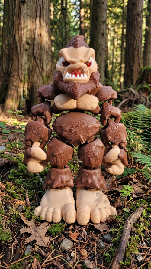 Full-color 3D printed Bigfoot Sasquatch flexi figure standing upright on a flat surface showing a complete front view