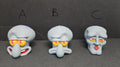 Close-up of the three different swappable face plate expressions labeled A, B, and C