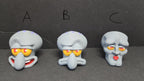 Close-up of the three different swappable face plate expressions labeled A, B, and C