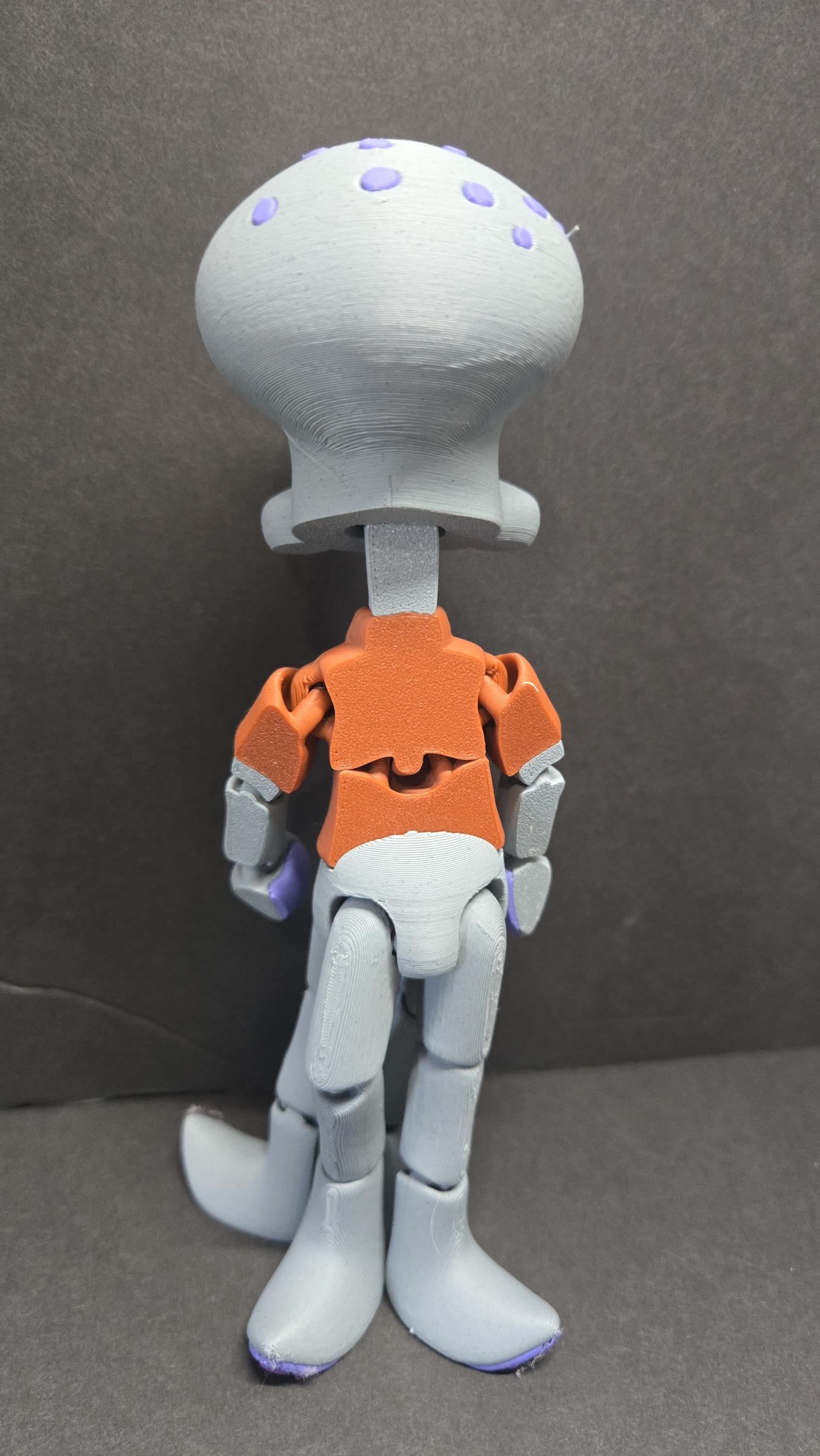 Rear view of the 3D printed neighbor figurine showcasing the articulation and build quality