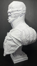 Three-quarter left profile view of the unpainted Chatterer bust showcasing the stitched jawline and shoulder plate detail