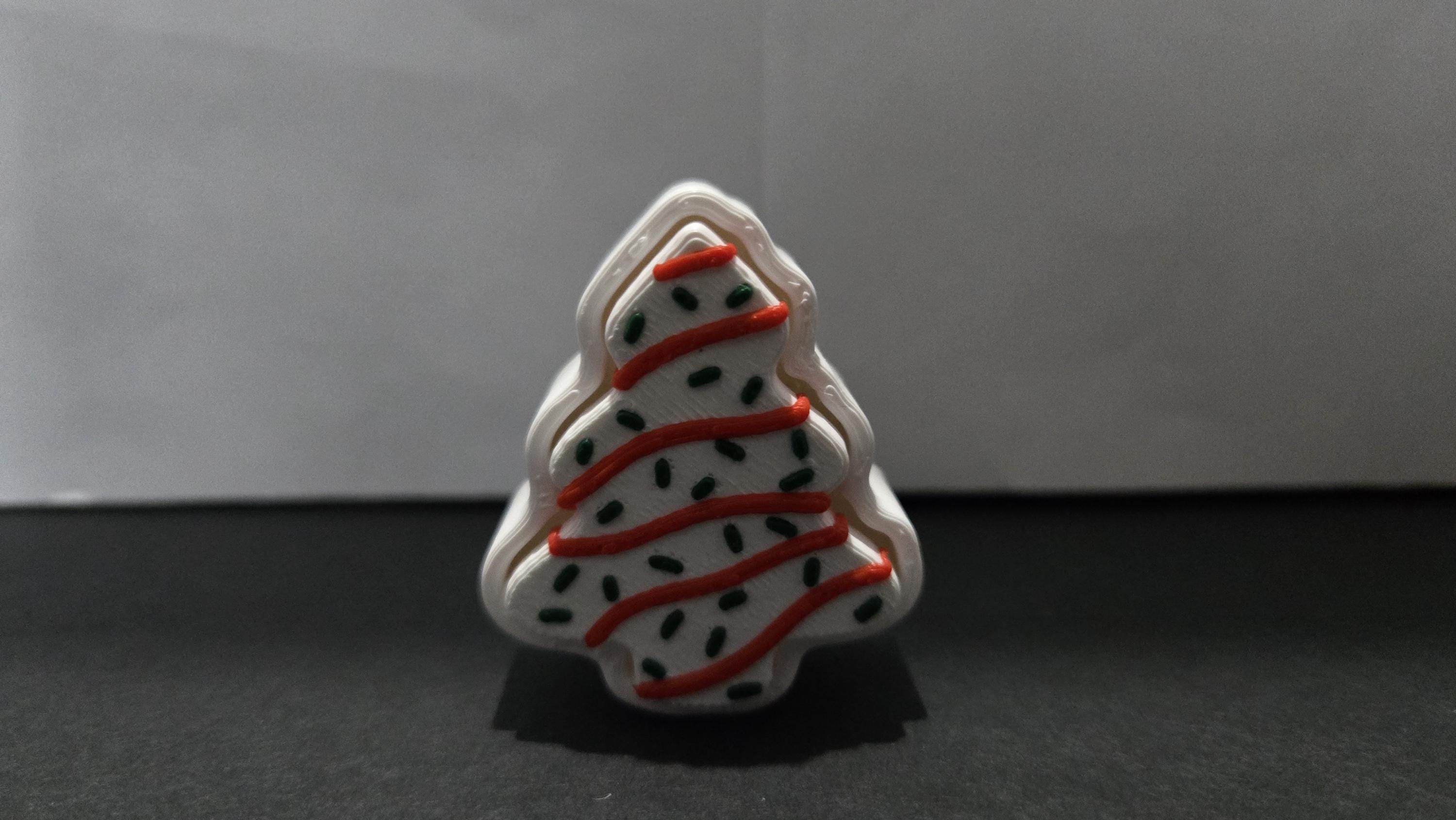 Straight front view of the 3D printed Christmas tree snack cake fidget toy