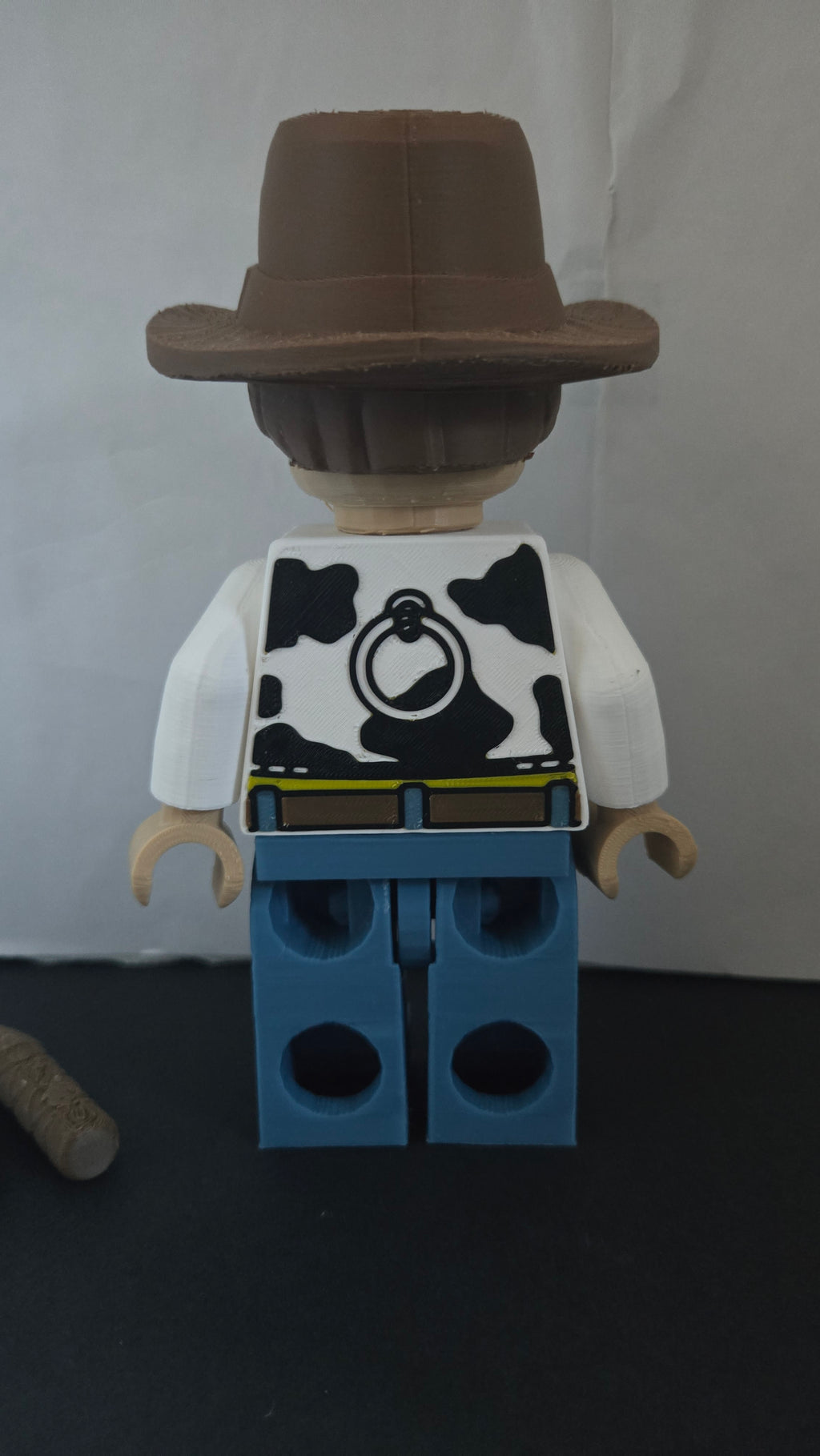 Rear view of the oversized cowboy sheriff brick megafig showing back vest details and studs