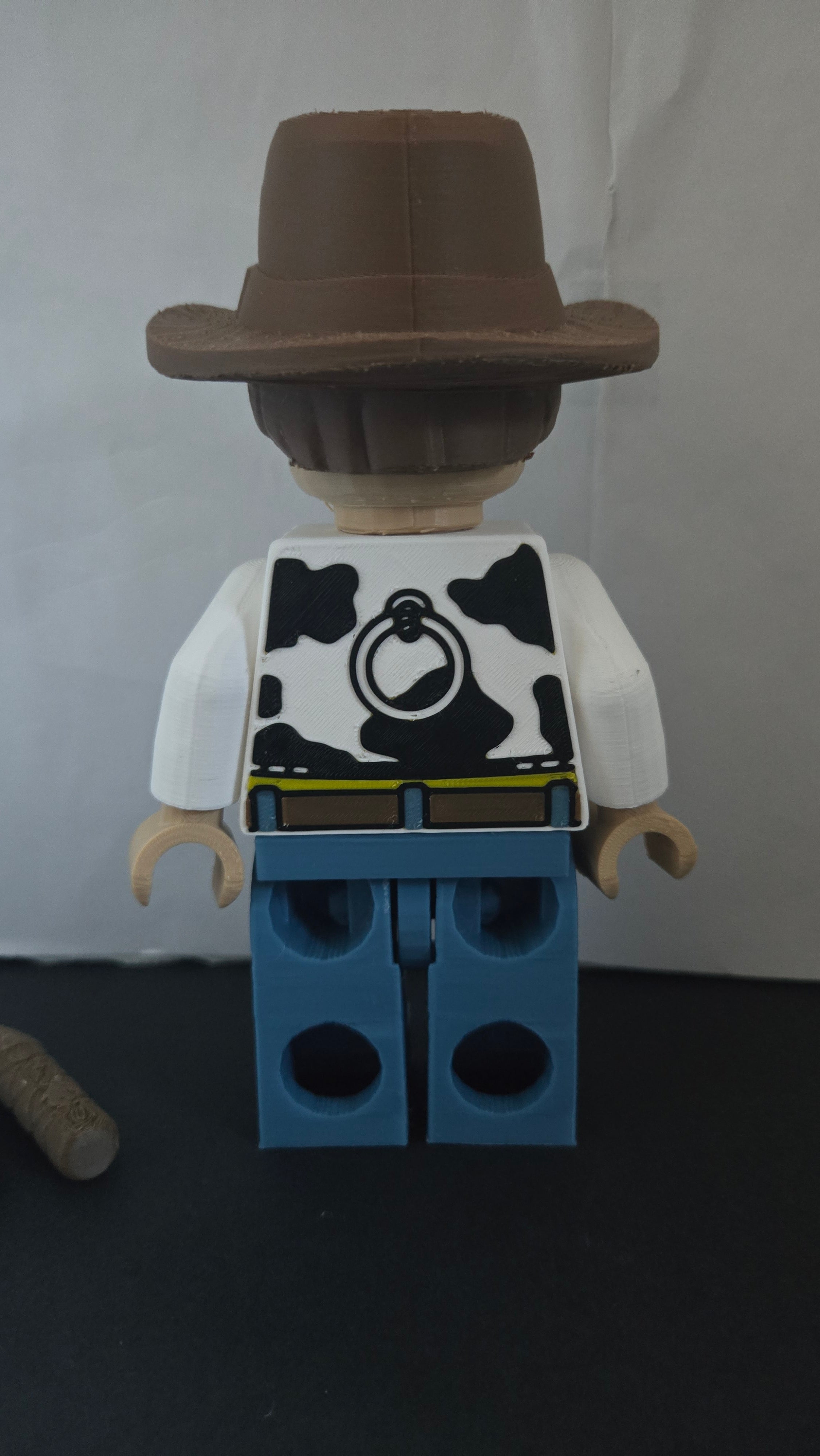 Rear view of the oversized cowboy sheriff brick megafig showing back vest details and studs