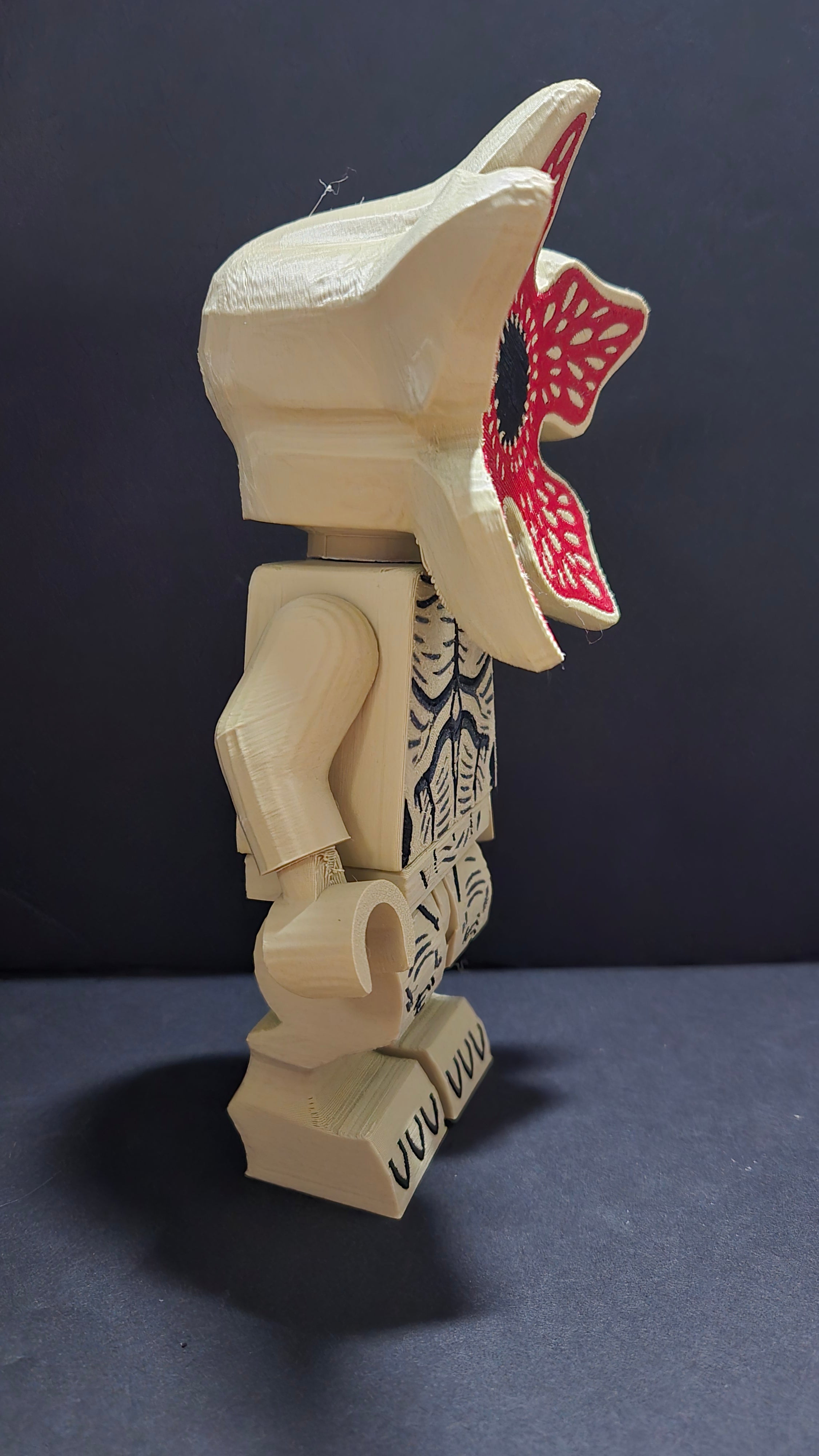 Right side profile view of the Demogorgon brick megafig showing the head shape and body texture