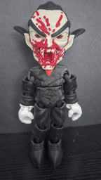 Full front view of the 7.5-inch Dracula flexi figure standing on a dark studio surface