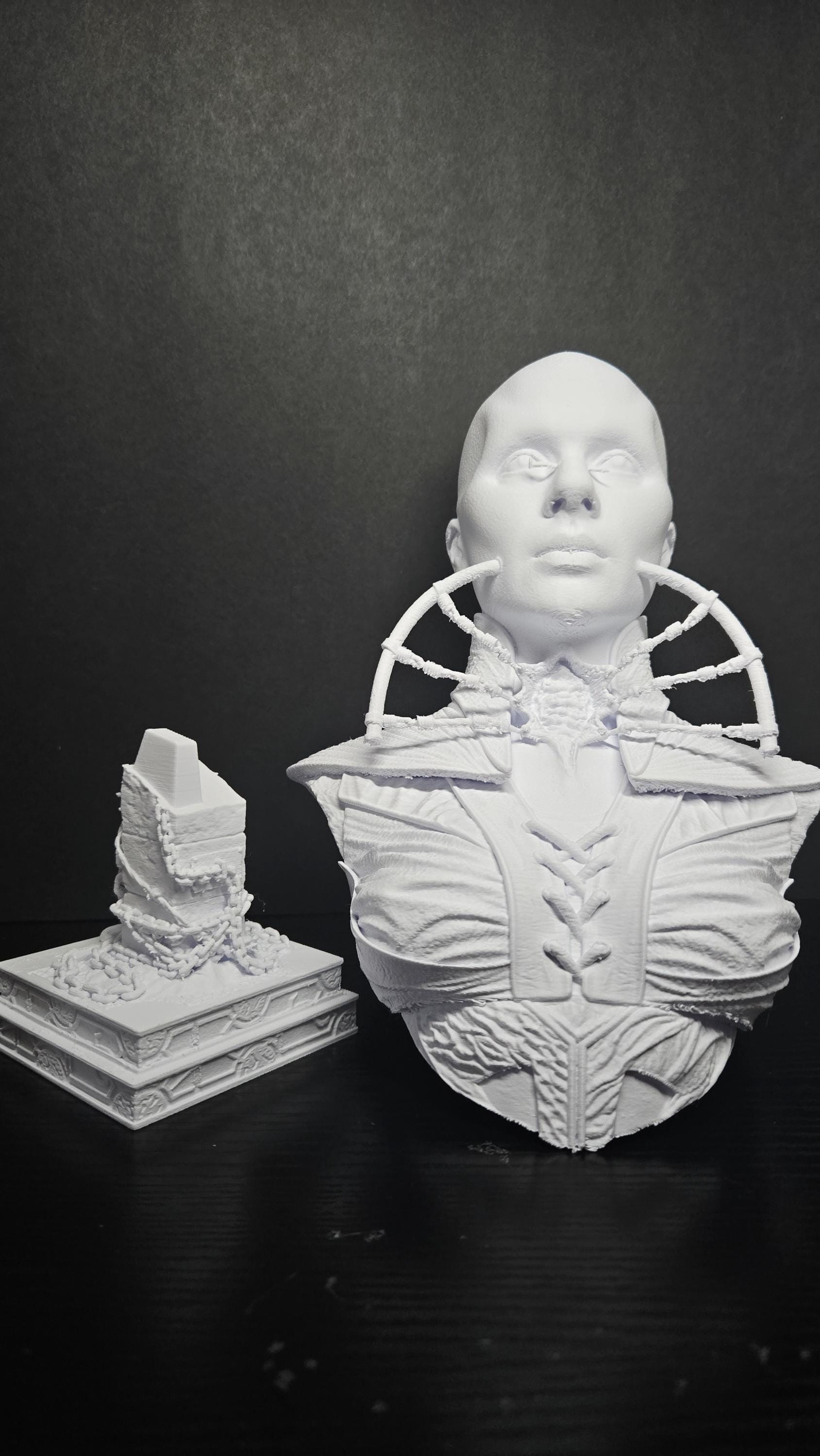 Unpainted 3D printed Female Cenobite bust shown next to its separate display base