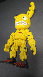 Three-quarter left profile view of the 3D printed Spring Trap figurine highlighting the clean multi-color print transitions