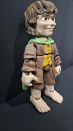 Right side view of the jointed Frodo Baggins figure slightly flexed to demonstrate the dynamic movement of the leg and arm segments