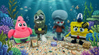 The complete 3D printed cartoon character squad displayed together in a vibrant, underwater-themed diorama with coral and treasure