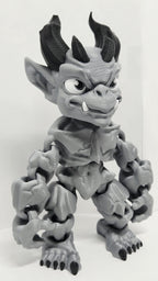 Right side view of the jointed gargoyle figure slightly flexed to demonstrate the dynamic structural movement of the plastic segments