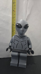 Measuring tape showing the towering height of the scaled oversized Grey Alien megafig