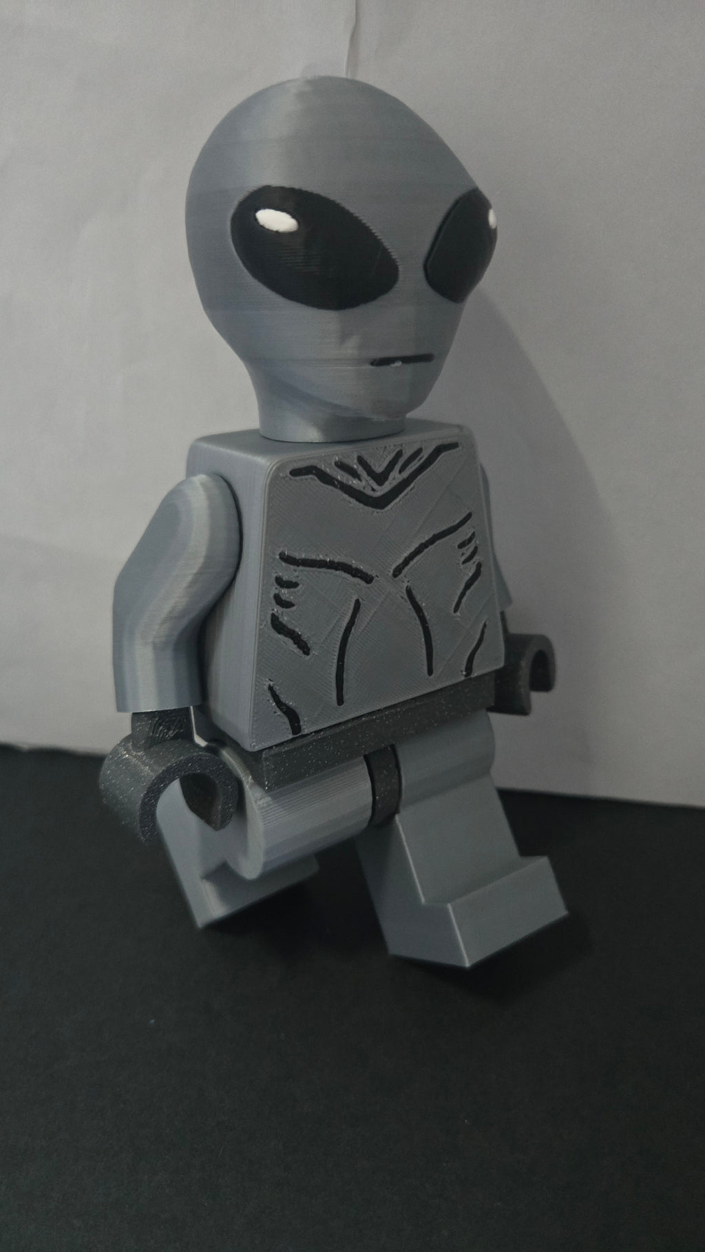 Side profile stride view of the 3D printed Grey Alien megafig