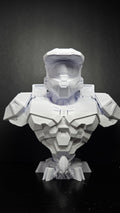 Unpainted white 3D printed Master Chief bust from Halo standing fully assembled on a black tabletop showing a complete front view