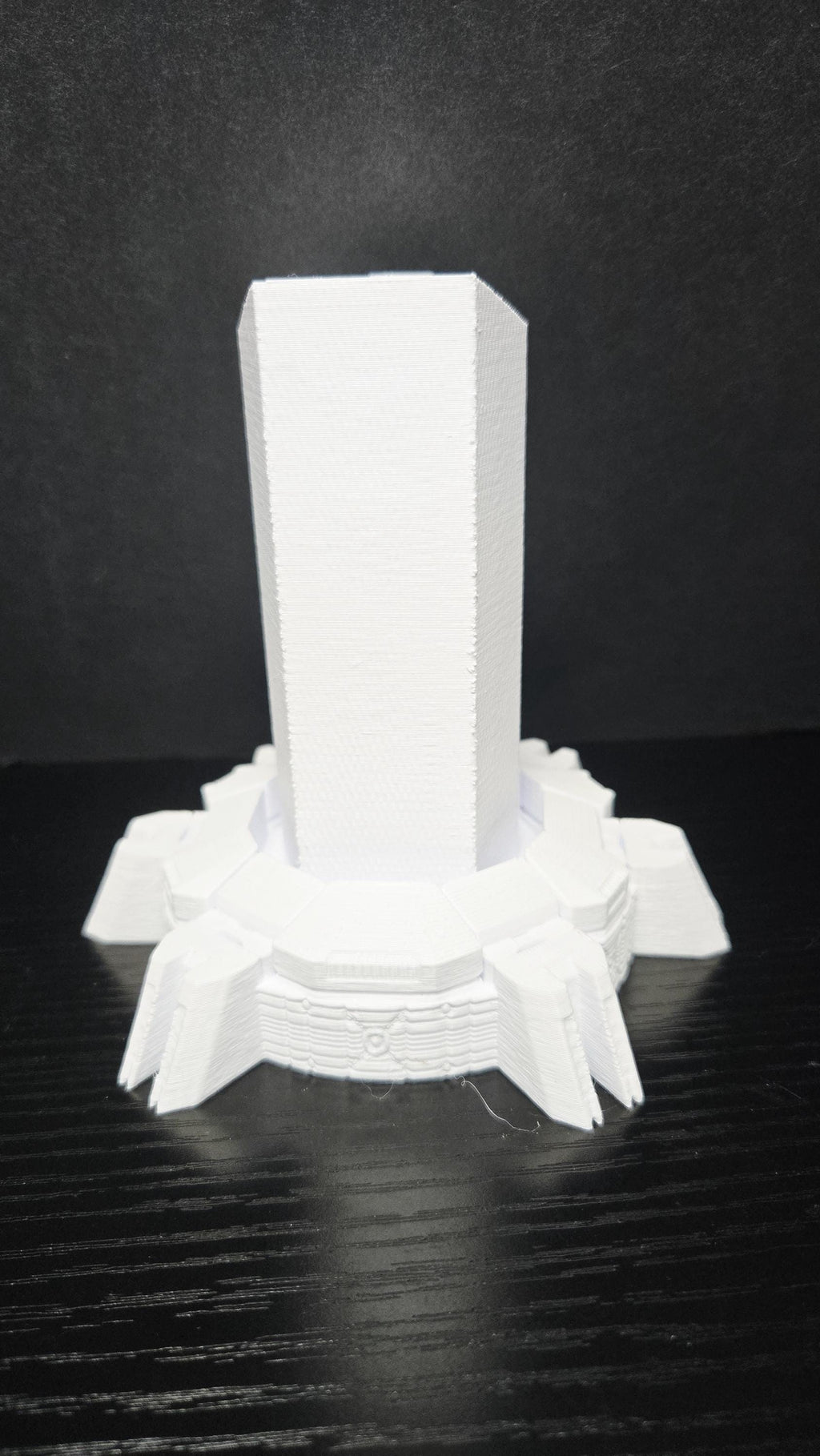 Rear view of the unpainted 3D printed sci-fi pedestal base highlighting the clean back panel support post