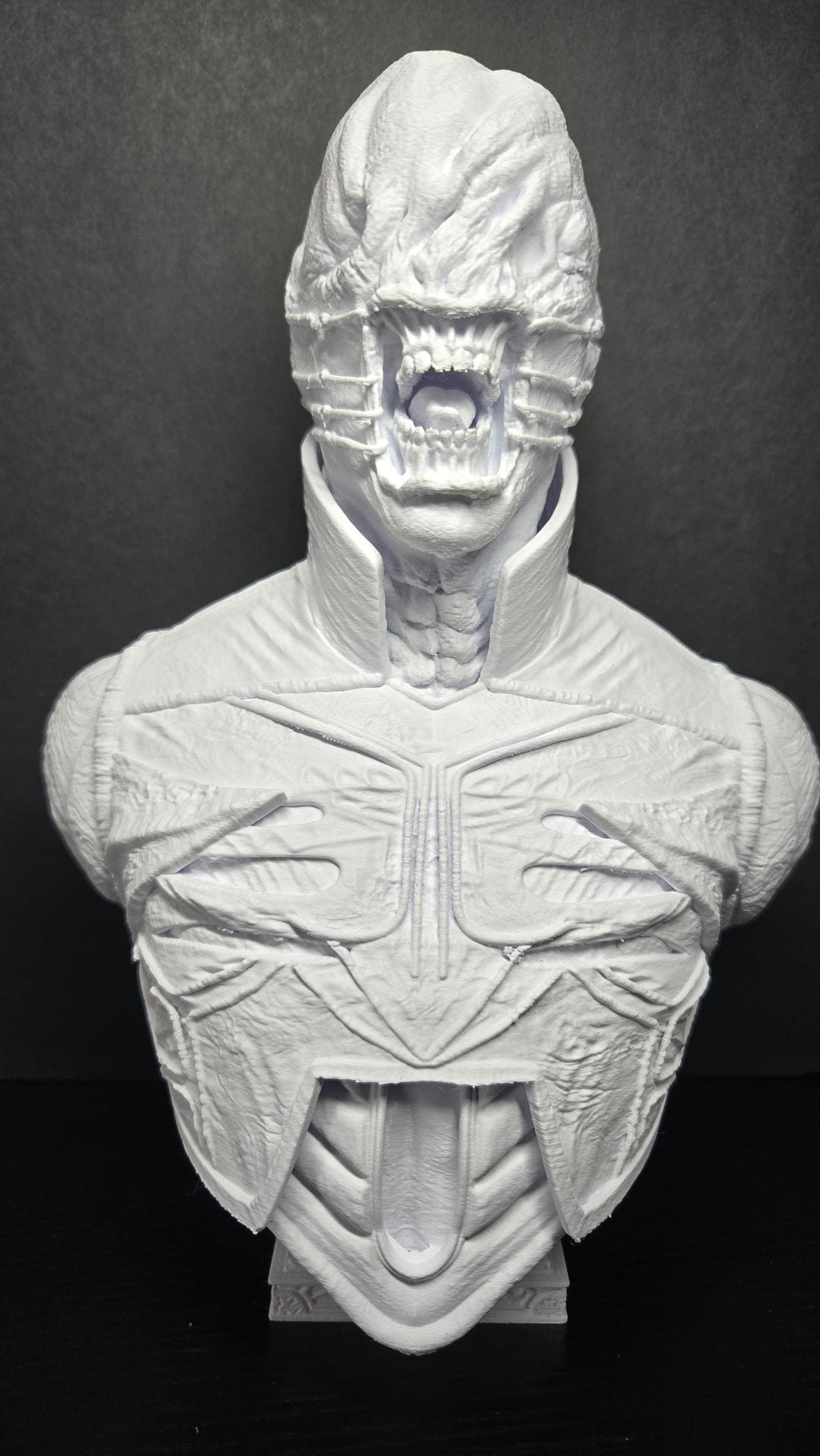 Unpainted white 3D printed Chatterer Cenobite bust from Hellraiser showing a complete front view of the grotesque face and leather armor