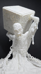 Close-up of the unpainted 3D printed figure holding the detailed puzzle box above its head