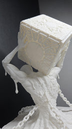 Side profile view of the unpainted Hellraiser diorama statue highlighting the figure emerging from the base