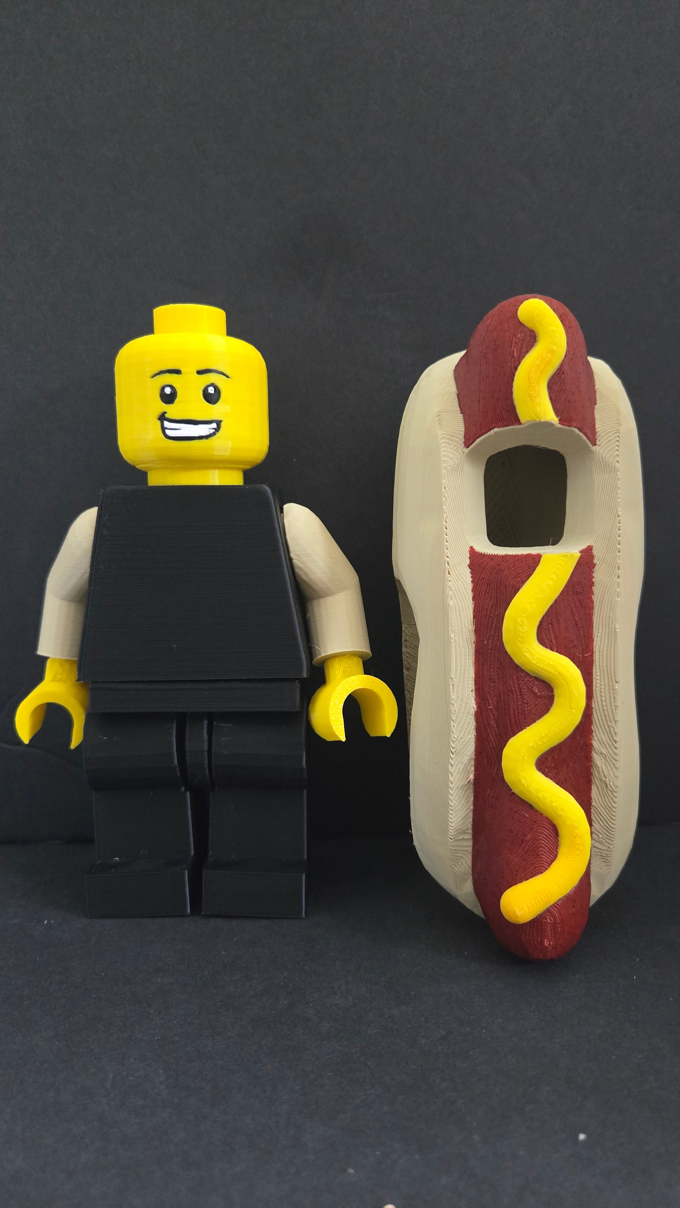 Hot Dog Guy brick megafig standing next to its detachable hot dog bun costume shell