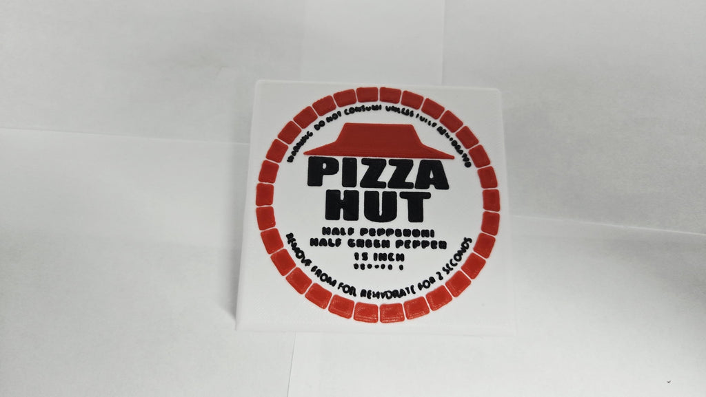 Close-up of the dehydrated Pizza Hut disk prop with authentic logo details