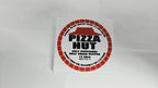 Close-up of the dehydrated Pizza Hut disk prop with authentic logo details