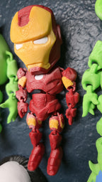 Left side profile view of the flexible Iron Man toy showing the shoulder armor plates and arm articulation joints