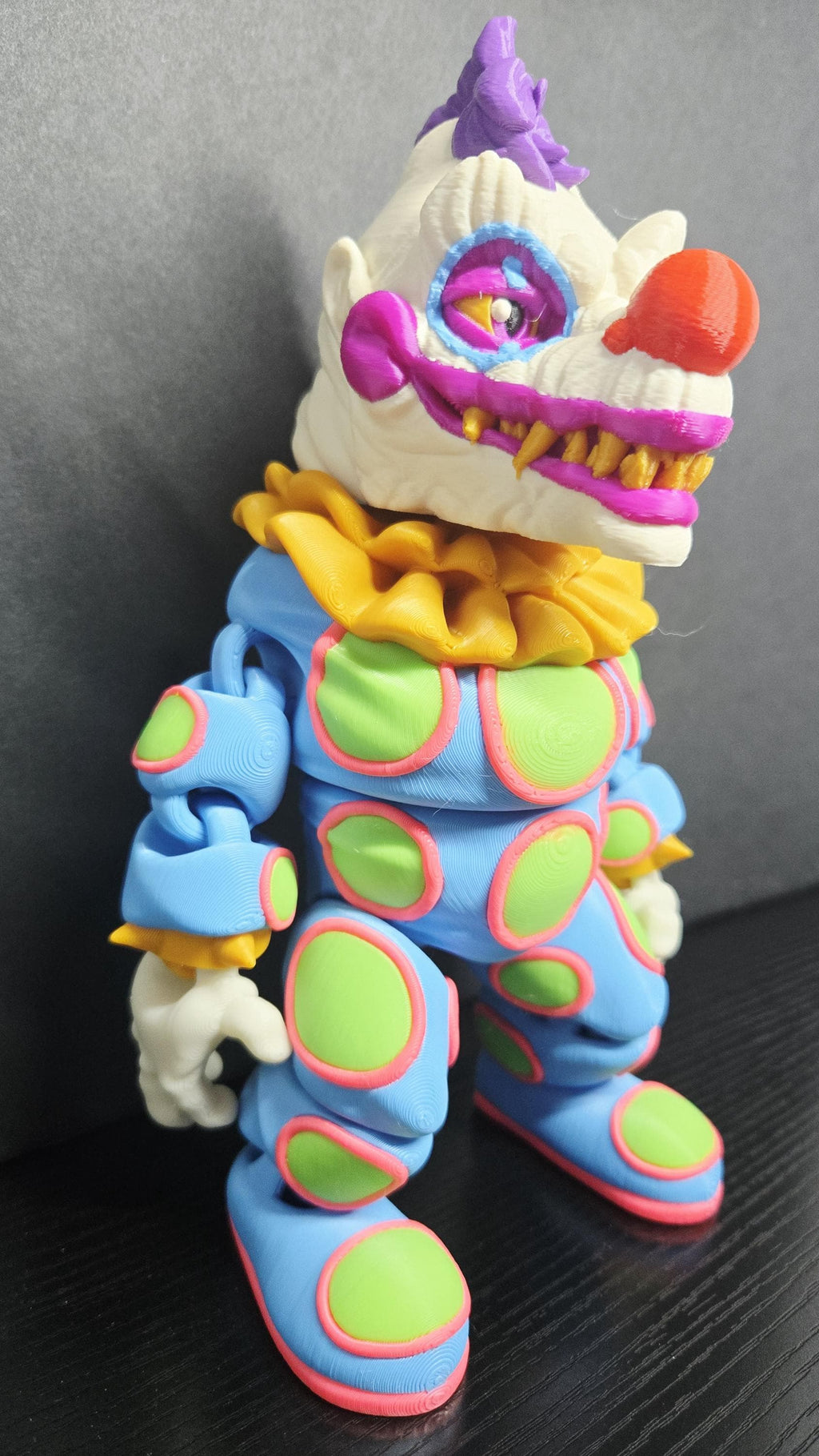 Three-quarter view of the Klownzilla flexi figure highlighting his poseable limbs and jointed segments