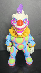 Straight front view of the 3D printed Klownzilla flexi figure showing his vibrant neon-spotted suit