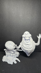 The 3D printed Library Ghost diorama disassembled into its modular parts, showing the ghost figure separated from the slime-textured base
