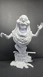 Straight front view of the unpainted 3D printed Library Ghost diorama on a black background showing the ghost on a slime-textured base