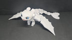 Light Fury flexi dragon figure posed in a dynamic flight stance