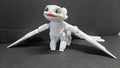 Full-color 3D printed Light Fury flexi figure with wings spread standing in a display-ready pose