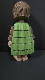 Rear view of the 3D printed Frodo Baggins figurine showcasing the clean jointed interlocking segments along the back of his green cloak