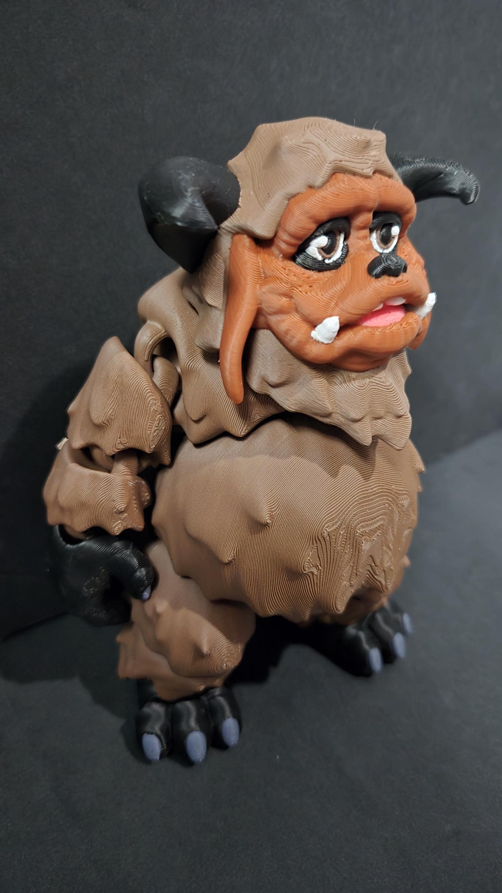 Right side view of the jointed Ludo figure slightly flexed to demonstrate the dynamic movement of his long arms and heavy leg segments