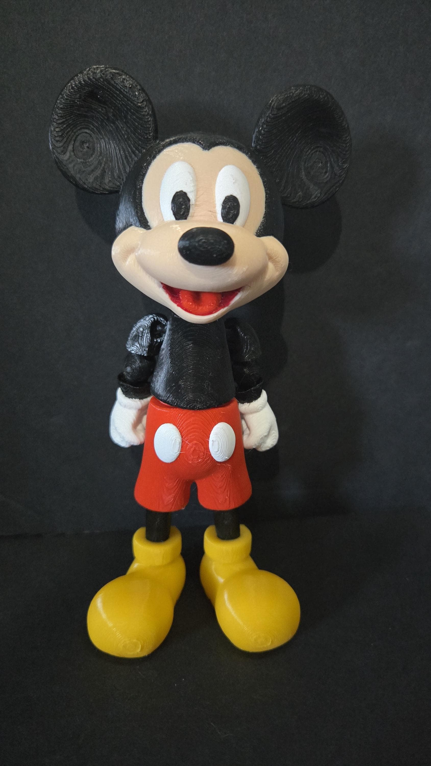 Full-color 3D printed Mickey Mouse flexi figure standing upright for a complete front view