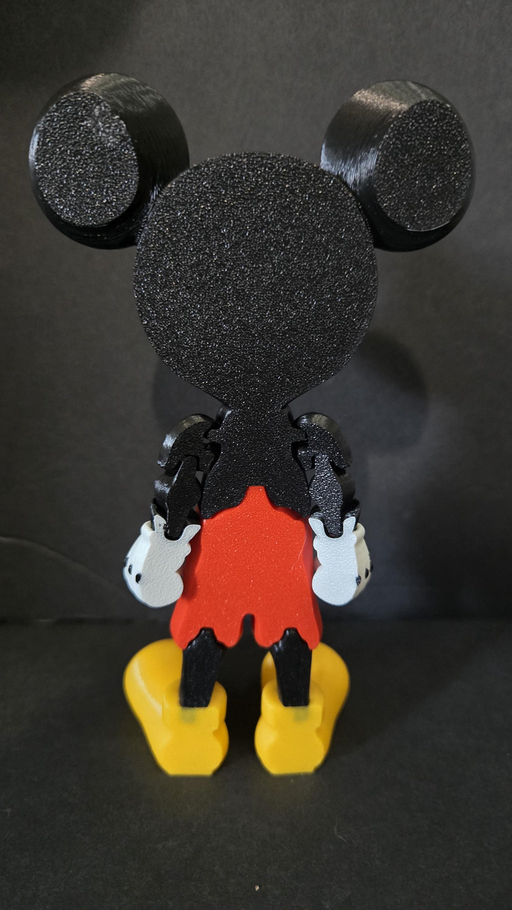Rear view of the 3D printed Mickey Mouse figurine showcasing the clean jointed interlocking segments