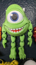 Right side view of the jointed Mike Wazowski figure slightly flexed to demonstrate the dynamic movement of the arm and leg segments