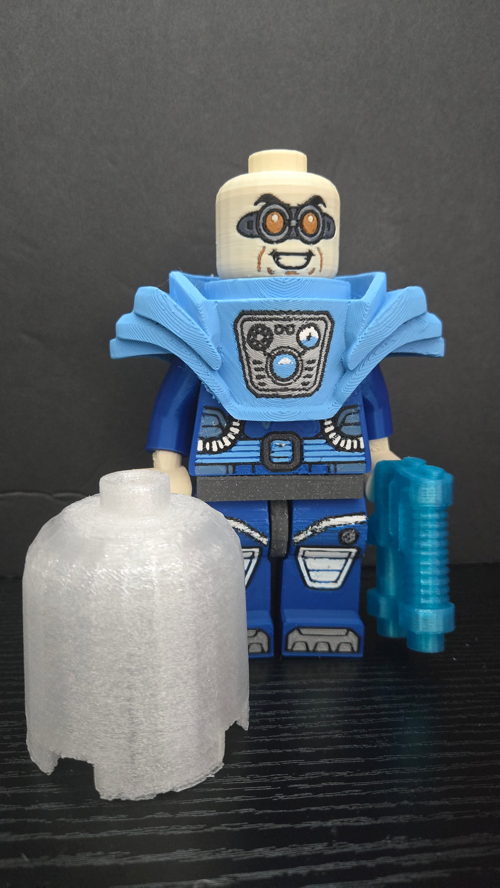 Oversized Mr. Freeze brick megafig standing with his freeze gun and translucent dome helmet set in front
